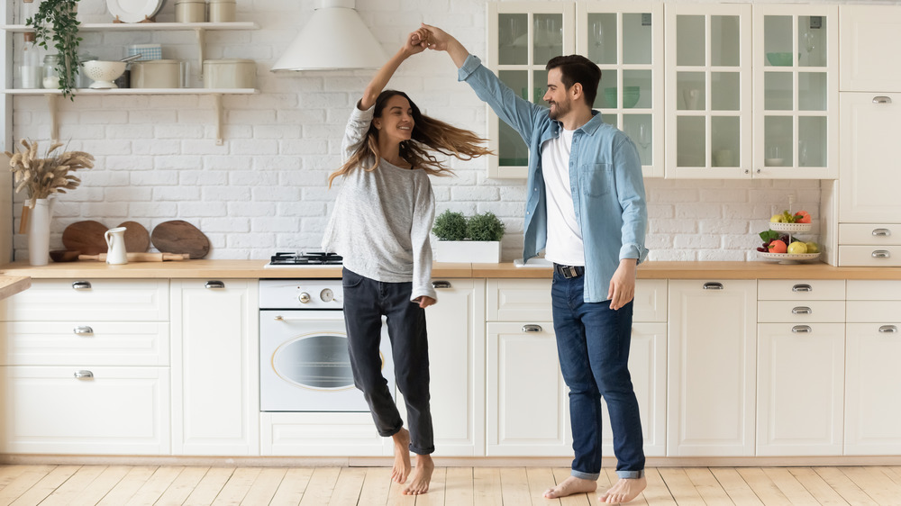 couple celebrating beautiful kitchen