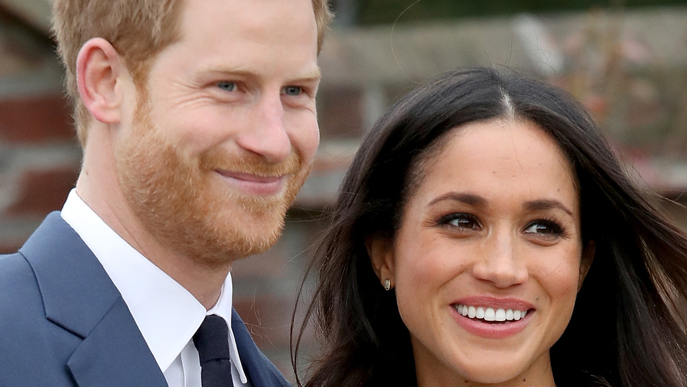 Prince Harry and Meghan Markle smiling together