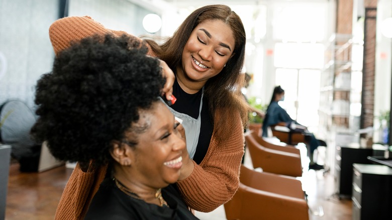 Hairstylist doing a clients hair