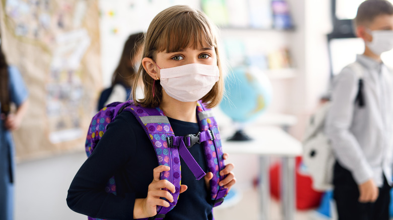 Girl at school wearing face mask