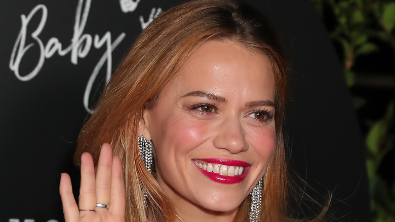 Bethany Joy Lenz smiling with bright pink lipstick