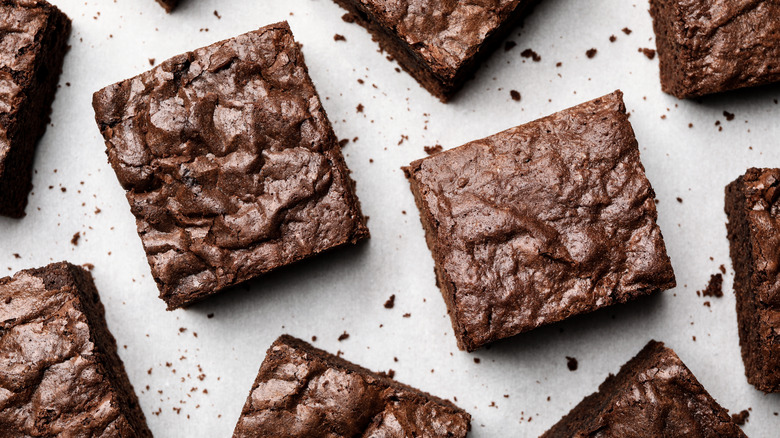 Brownies spread out across a counter surface