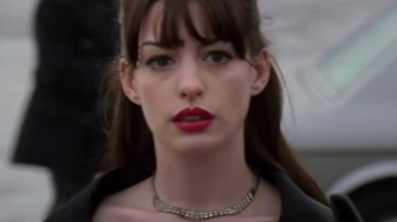 Anne Hathaway wearing red lipstick in The Devil Wears Prada
