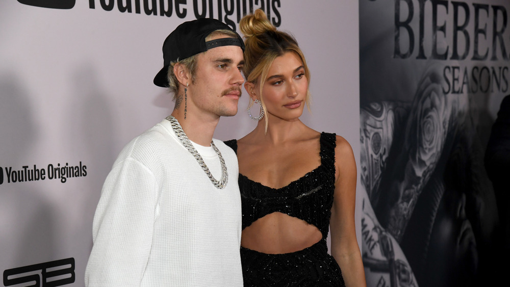 Justin and Hailey Bieber posing on red carpet