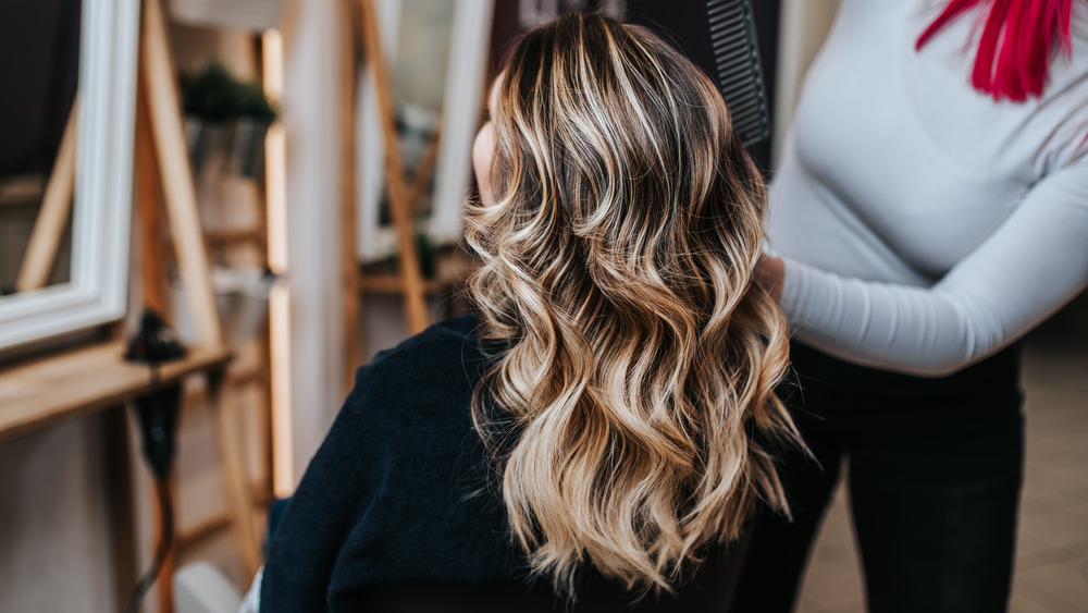 Blonde woman in a salon chair