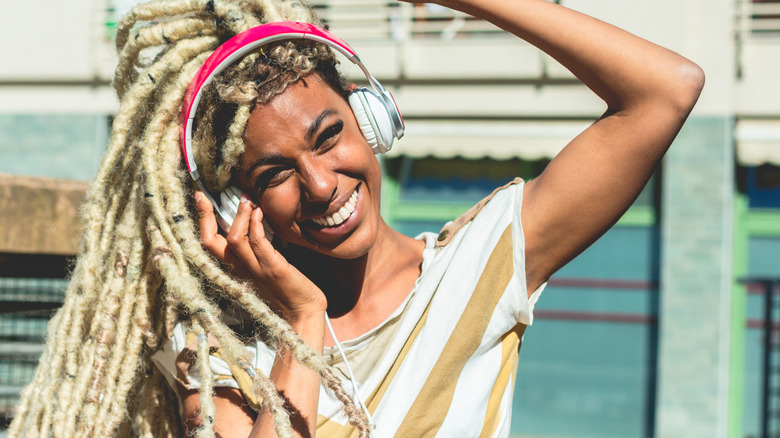 A woman with dreadlocks smiling