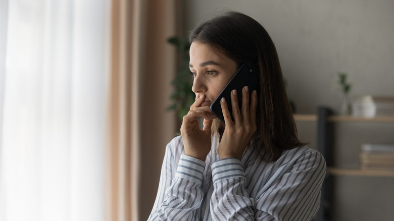 Sad woman with phone