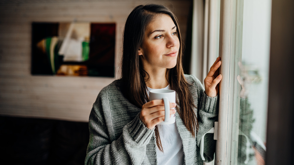 woman holding mug