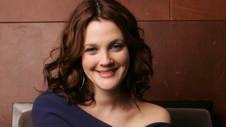 Drew Barrymore poses with a smile.