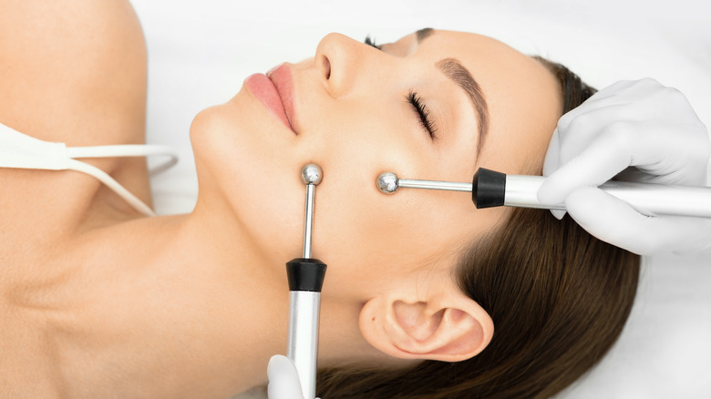 Woman having microcurrent treatment