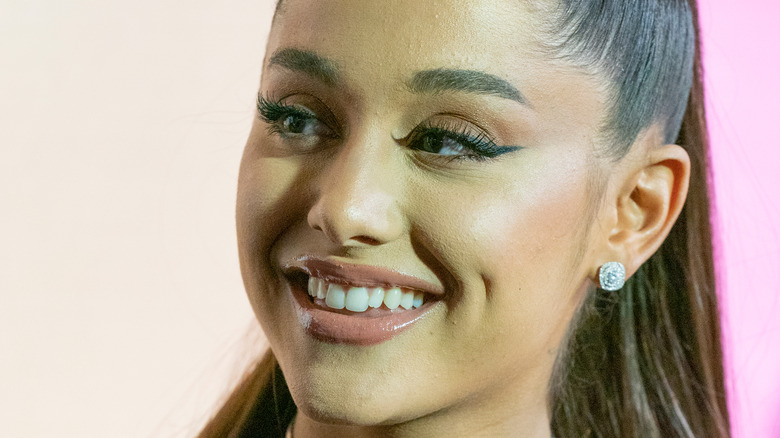 Ariana Grande smiling looking away from camera