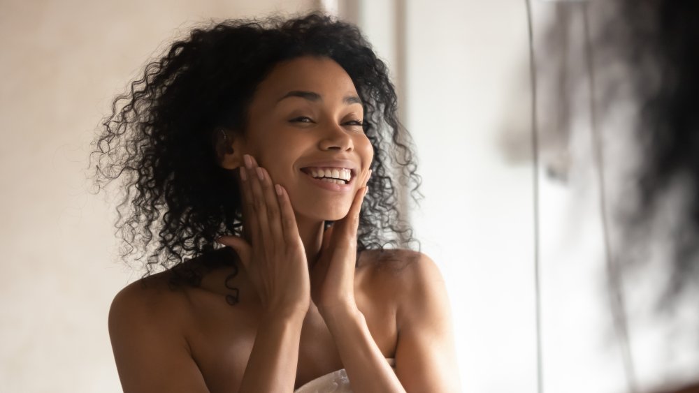 Woman patting her face