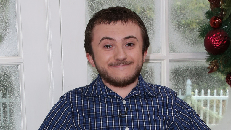 Close-up of Atticus Shaffer smiling