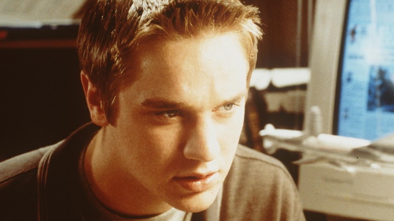 Young Devon Sawa smirking 