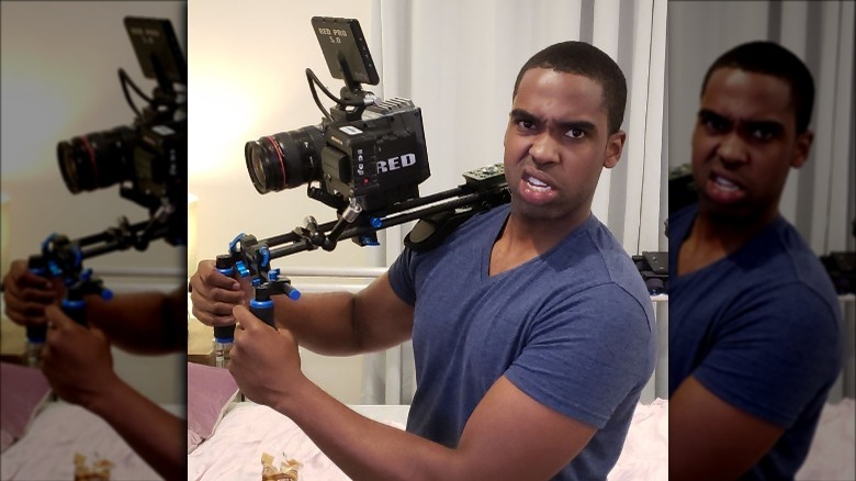 Actor Daniel Curtis Lee poses with a camera