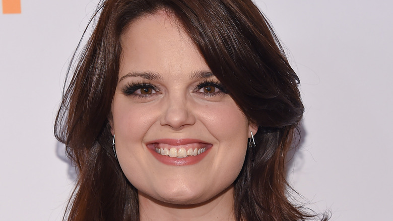 Kimberly J. Brown smiling for the camera 