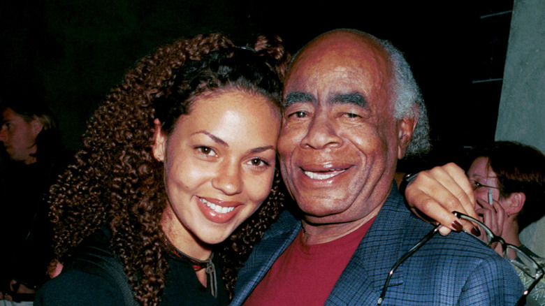 Roscoe Lee Browne and a friend hug outside Spago's restaurant April 23, 2001 in Los Angeles, CA.