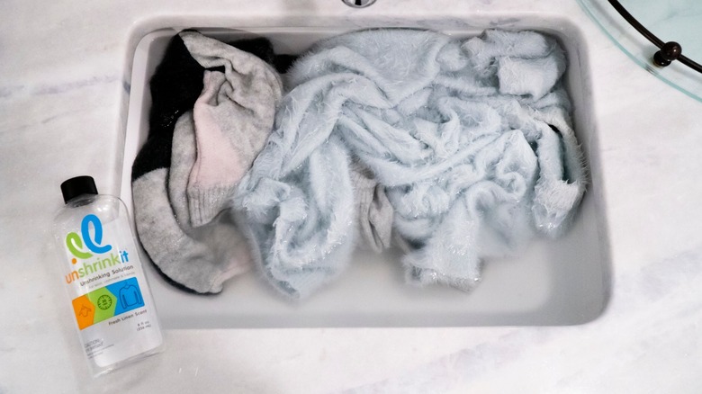 clothes soaking in Unshrinkit solution