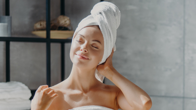 woman wrapped in towel after bath