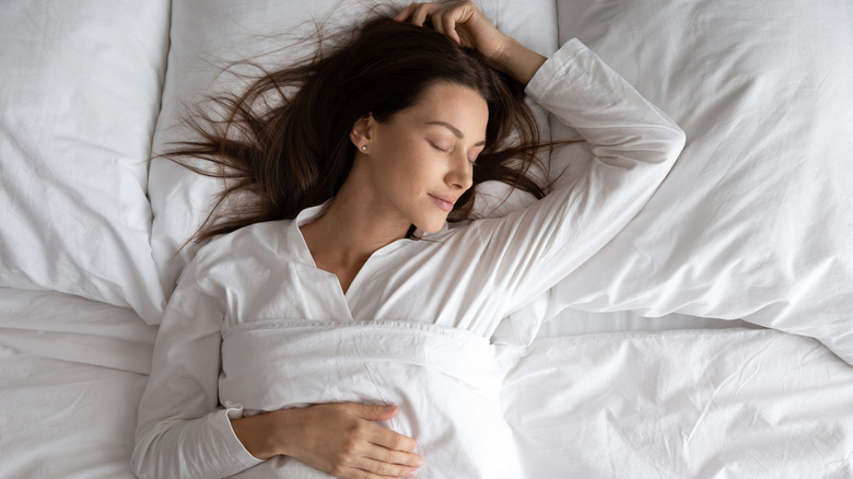 Woman sleeping in bed 