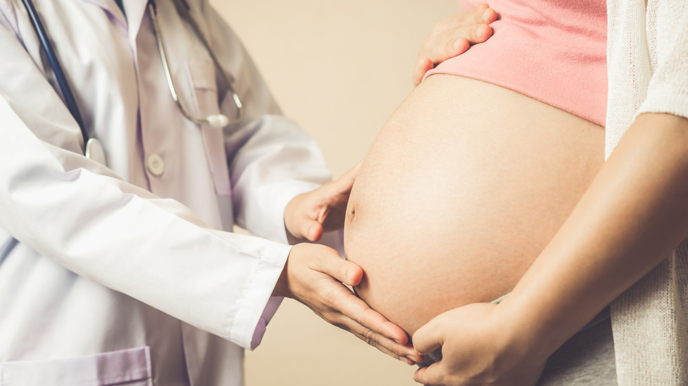 Pregnant woman and her doctor