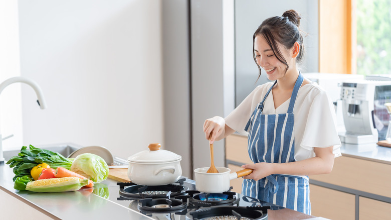 Woman cooking in her kitchen