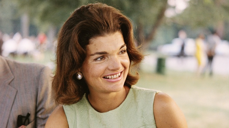 Jackie Kennedy smiling at a picnic