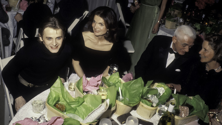 Jackie Kennedy at formal dinner with group
