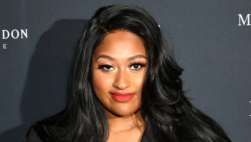 Jazmine Sullivan smirking
