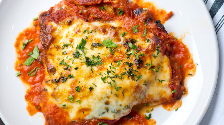 Chicken parm on a whilte plate