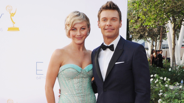 Julianne Hough wearing a blue gown and Ryan Seacrest in a tux