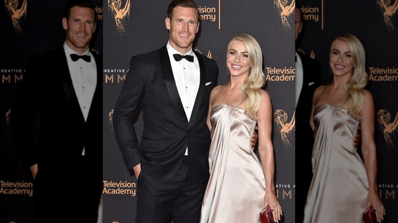 Brooks Laich wearing a tux and julianne hough wearing a light pink gown