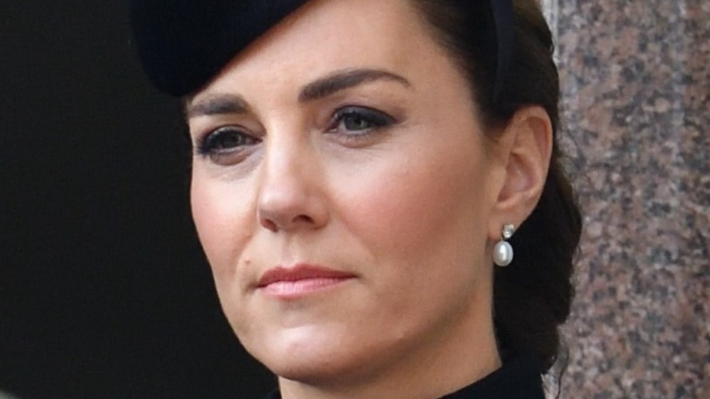 Kate Middleton looking serious in black