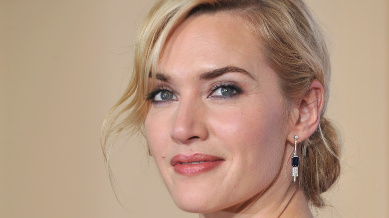 Kate Winslet smiling over the shoulder