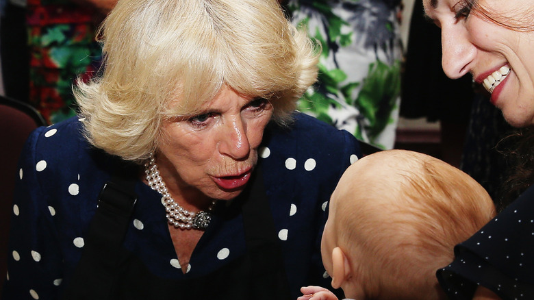 Camilla greets baby