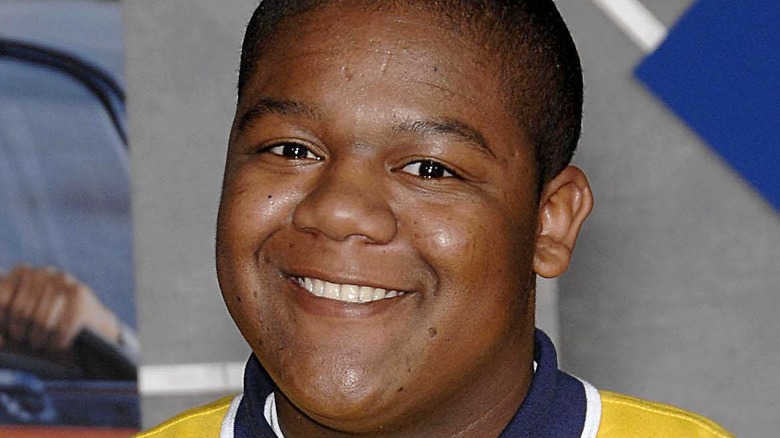 younger Kyle Massey smiling at camera