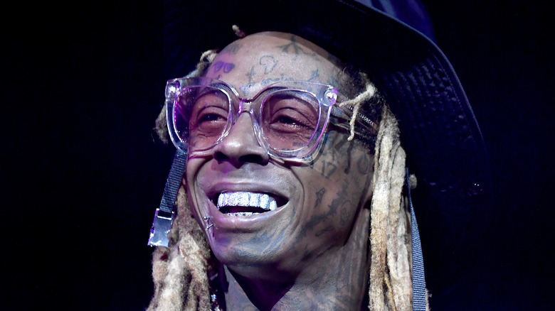 Lil Wayne smiles onstage