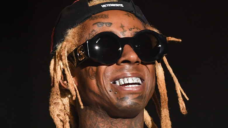 Lil Wayne smiles onstage