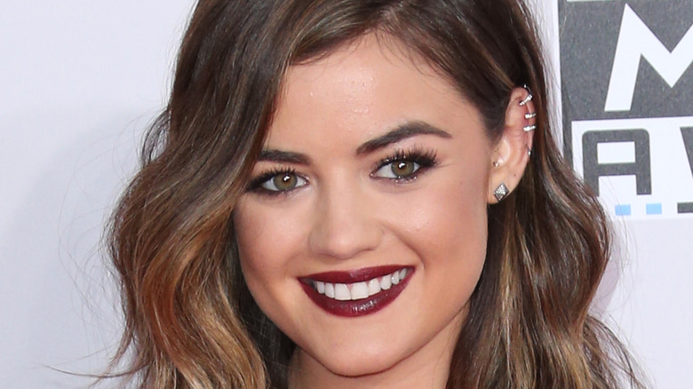 Lucy Hale smiling on red carpet