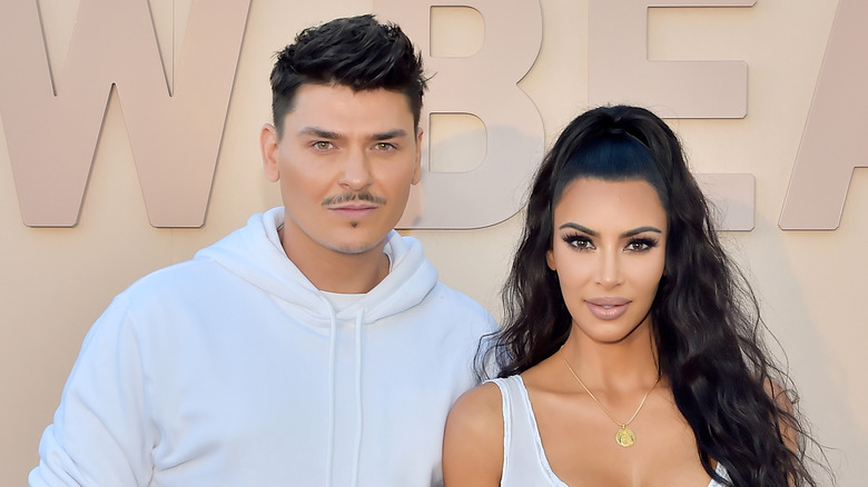 Mario Dedivanovic posing with Kim Kardashian at KKW beauty event 