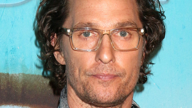 Matthew McConaughey wearing glasses at an event