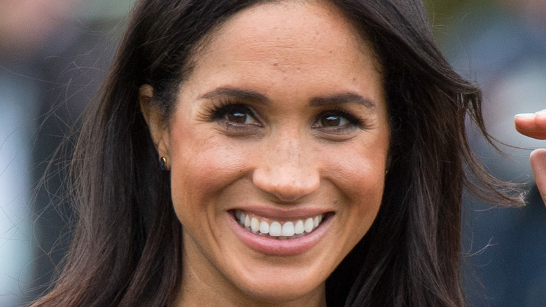 Meghan Markle photographed smiling at an event