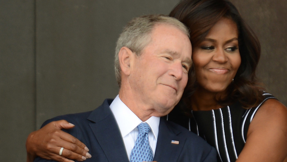 Michelle Obama and George W. Bush hugging