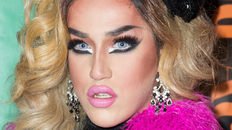 Adore Delano poses on the red carpet