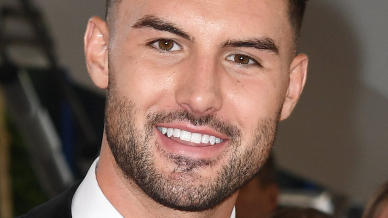 Liam Reardon smiling at an event