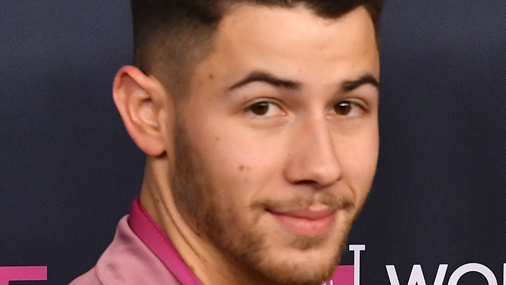 Nick Jonas grinning 
