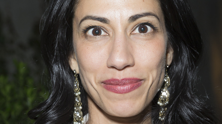 Huma Abedin wearing drop earrings