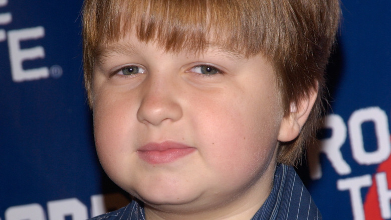 young Angus T. Jones posing