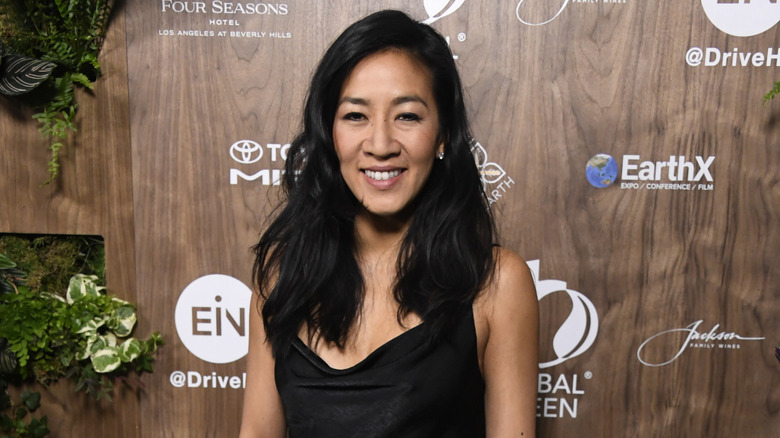 Michelle Kwan posing on step-and-repeat