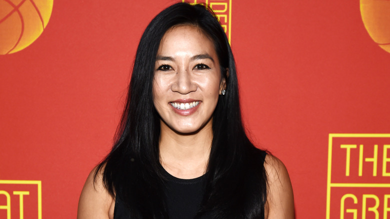 Michelle Kwan smiling on step-and-repeat